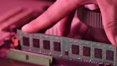 Technician Hand Installing DDR RAM Memory Module into Motherboard Slot for .. Video stock 335145129