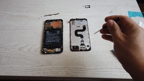 Technician hands close up detail repairing smart phone Stock Footage 124877053