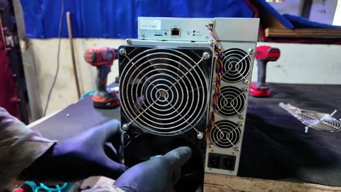 Technician Hands Installing Cooling Fan on Bitmain Antminer S9 Bitcoin Mining Stock Footage 324937276