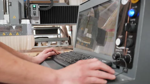 Technician hands operating the control panel of high precision CNC machine Stock Footage 160761030