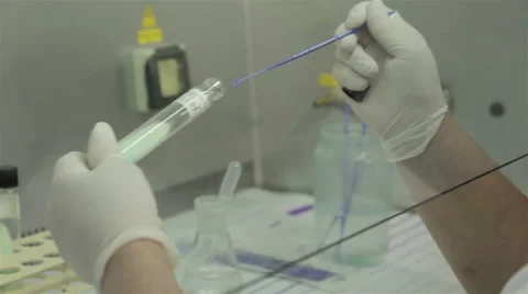 Technician hands wearing protective gloves,open test tubes and analyzing samples Stock Footage 50263697
