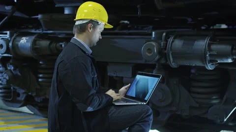 Technician in Hard Hat Using CAD Program on Laptop Stock Footage 56231610