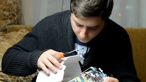 The technician hold the screwdriver for repairing the computer. the concept o Video stock 81673279