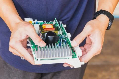Technician holding computer electronic circuit board in the hand. Stock Photos