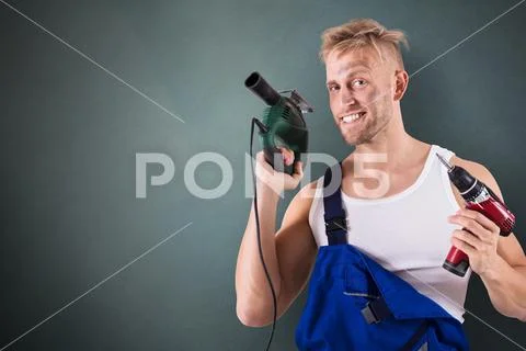 Technician Holding Electric Drill And Screwdriver Stock Photos
