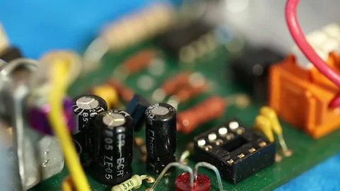 Technician inserts a chip into a cell of the circuit board. macro shooting Stock Footage 72582947
