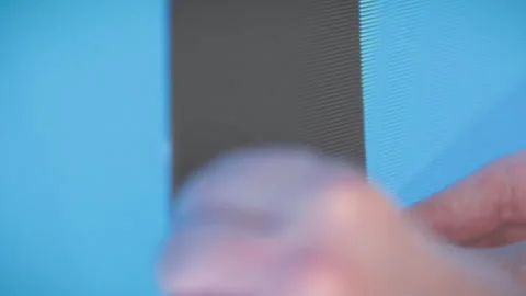 Technician inserts missing part of an LED wall, repair of digital screens, Stock Footage 286711403