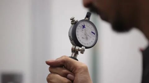 Technician inspect engine part with mitutoyo gage micrometer of check component Video stock 303477453