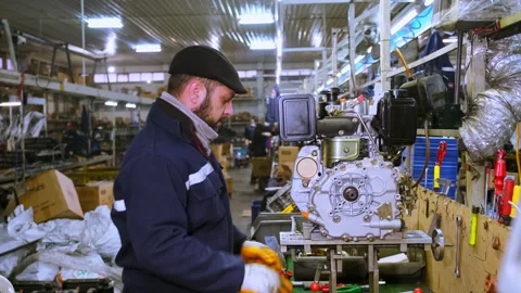Technician Inspecting and Assembling Diesel Engine in Mechanical Workshop Stock Footage 308043268