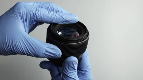 Technician Inspecting Camera Lens in Blue Protective Gloves Video stock 346410281
