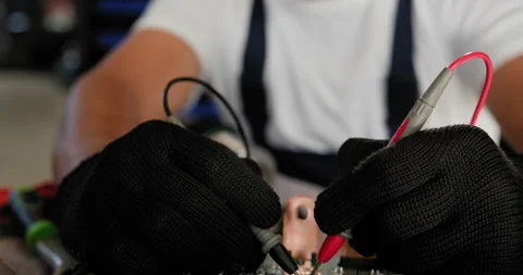 Technician Inspecting Electronic Control Unit With Probes Stock Footage 277152467