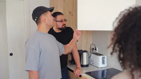Technician Inspecting Kitchen Cabinet During Apartment Visit Vídeo Stock 342956720