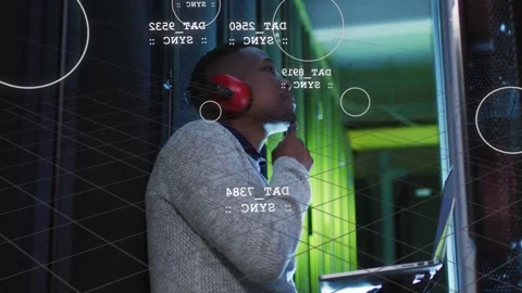 Technician inspecting rack status and touching chin while HUD data overlays and Stock Footage 333139125