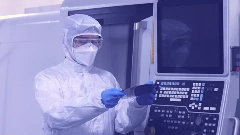 Technician Inspecting Silicon Wafer in Semiconductor Cleanroom Stock Footage 344213543