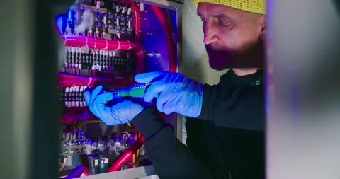 Technician Inspecting Wiring in Engine Room 스톡 동영상 323749497