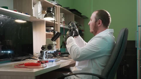 Technician Inspects Circuit Board Under Microscope Stock Footage 282649341