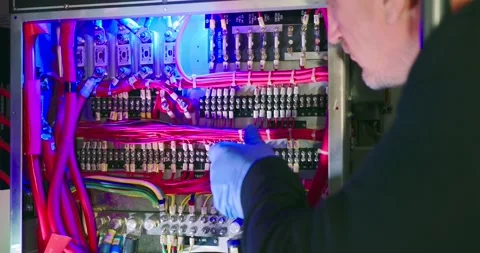 Technician Inspects Control Panel in Engine Room 스톡 동영상 323745431