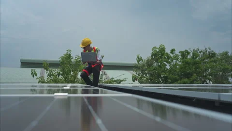 Technician inspects solar panel installation and test Stock Footage 282754876