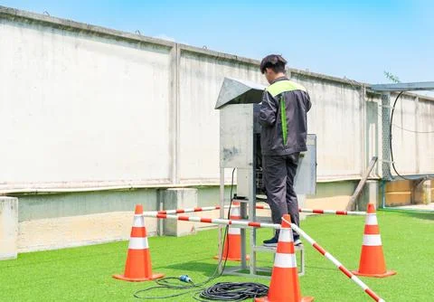 Technician install filter and sampling tube for ambient air measurement. Stock Photos
