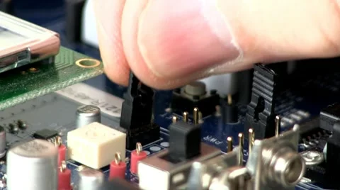 Technician install jumpers &amp; makes adjustments Stock Footage 10589028