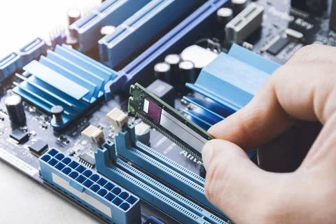 Technician install new RAM (Random-access memory) to memory slot Stock Photos