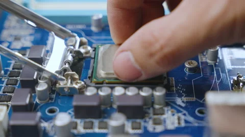 The technician installed the CPU chip on the computer's motherboard  스톡 동영상 234987451
