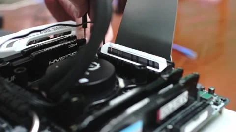 Technician installing All-in-one or AIO Water cooling on high-end CPU Video stock 158753494