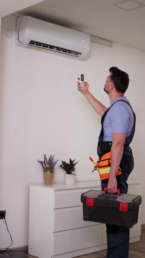 Technician installing and testing air conditioning unit Stock Footage 316483328