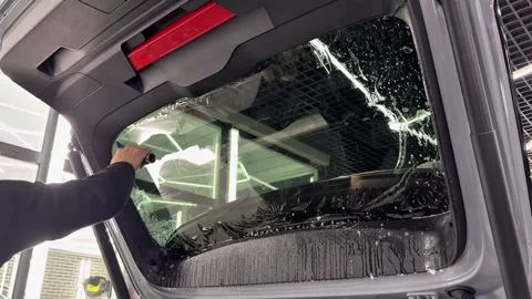 Technician Installing car window tint. Window toned film. Stock Footage 331116714