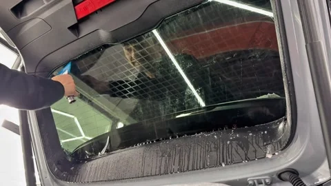Technician Installing car window tint. Window toned film. Stock Footage 331116717