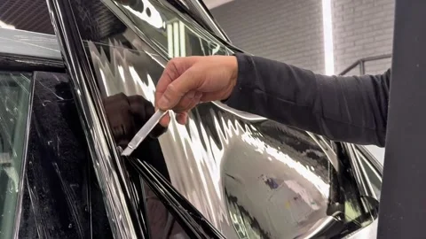 Technician Installing car window tint. Window toned film. Stock Footage 331116736
