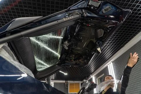 Technician Installing car window tint. Car window tinting series. Car windo.. Stock Photos