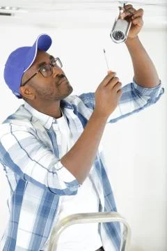 Technician is installing cctv camara system Stock Photos