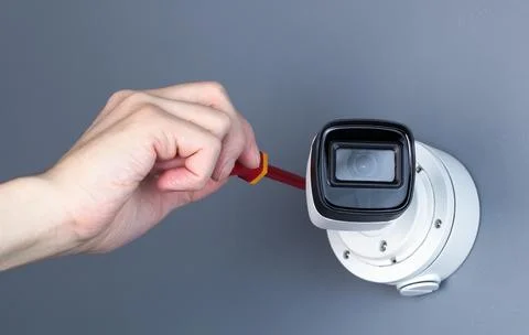Technician installing CCTV camera video security Stock Photos