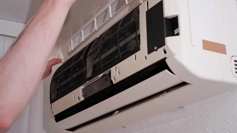 Technician installing cover on air conditioner Video stock 338008532