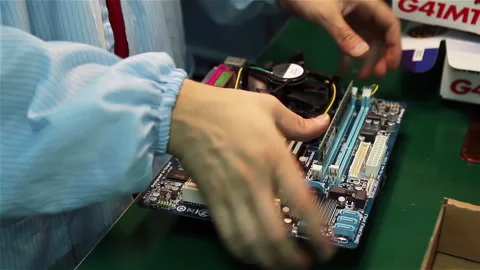 Technician Installing CPU Cooler and RAM Memory on Computer Motherboard - 4K Stock Footage 346778889