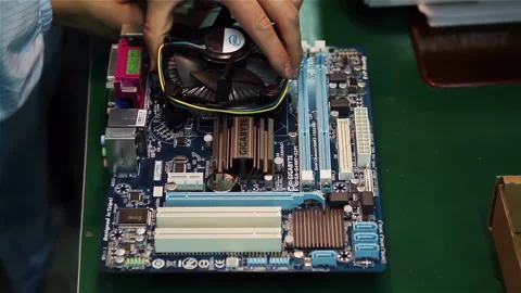 Technician Installing CPU on Desktop Motherboard in Factory, Close Up - 4K Stock Footage 329733150