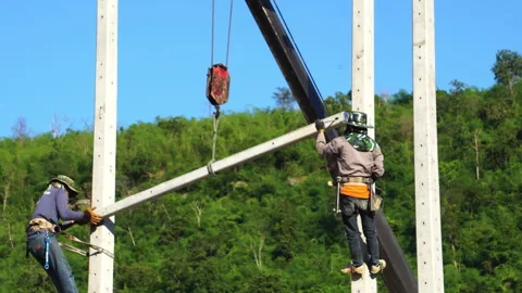 Technician installing equipment for high voltage electrical work on site Stock Footage 248156168