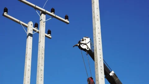 Technician installing equipment for high voltage electrical work on site Stock Footage 248163674