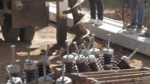 Technician installing equipment for high voltage electrical work on site Stock Footage 251552477