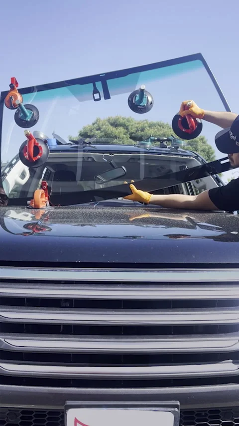 Technician installing new windshield car using tools and safety equipment Stock Footage 290512680
