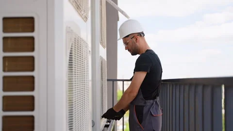 Technician installing outdoor unit of air conditioner. Air conditioner Stock-Footage 281212520