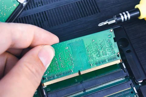 A technician installs a RAM (Random Access Memory) Stock Photos