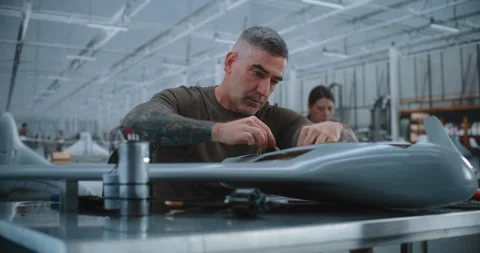 Technician Integrates Electronic Components, Cylindrical Module and Wiring Stock Footage 345057979