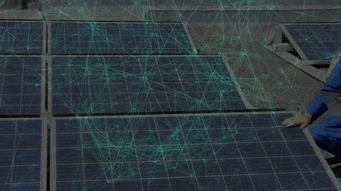 Technician kneeling inspecting solar panel array outdoors, showing network nodes Stock Footage 308026245