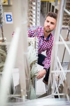 Technician looking at cables of the server Stock Photos