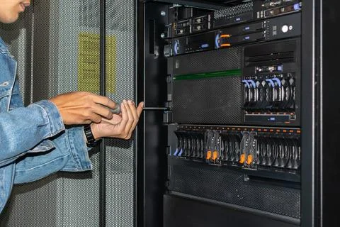 Technician Maintaining Server Rack Foto stock