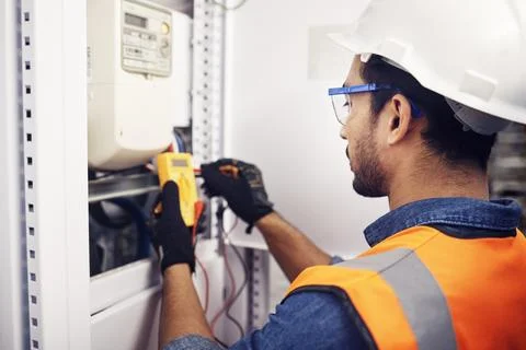 Technician, man and multimeter testing power for electricity, energy inspection Stock Photos
