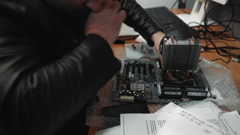 Technician man bought a hard ware to upgrade his computer. Professional computer Stock Footage 134332108