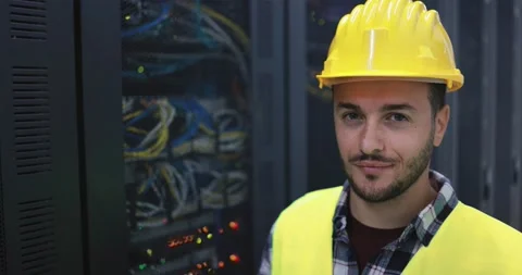 Technician man looking serious in camera inside server room Stock Footage 149302602
